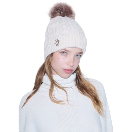 Cappello in maglia con pompon burro